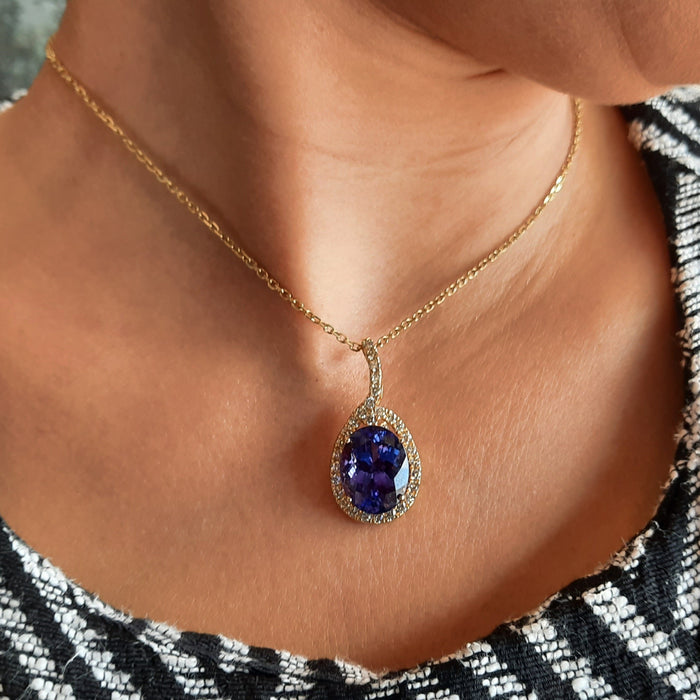 Tanzanite 13.05ct tw Pendant with 1.50 Diamonds in 14kt Gold
