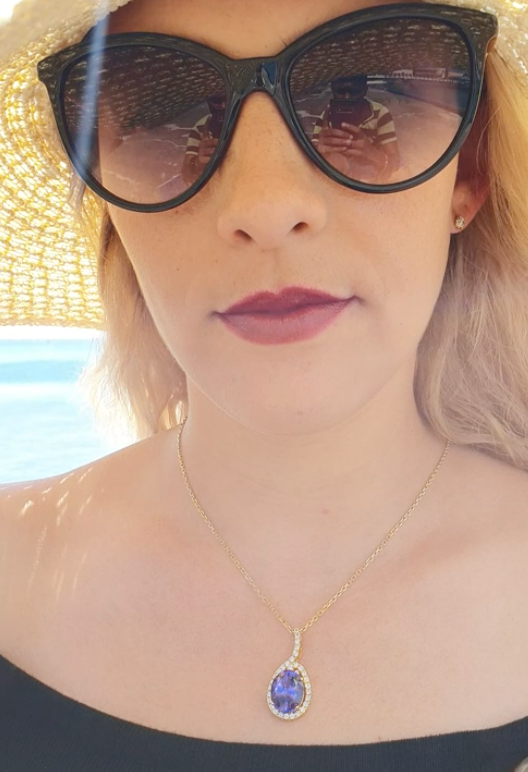 Tanzanite 13.05ct tw Pendant with 1.50 Diamonds in 14kt Gold